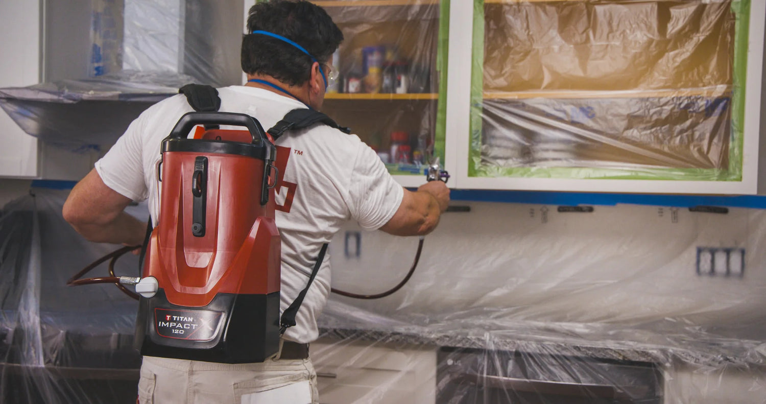 Contractor using the Titan Impact X 120 backpack sprayer indoors.